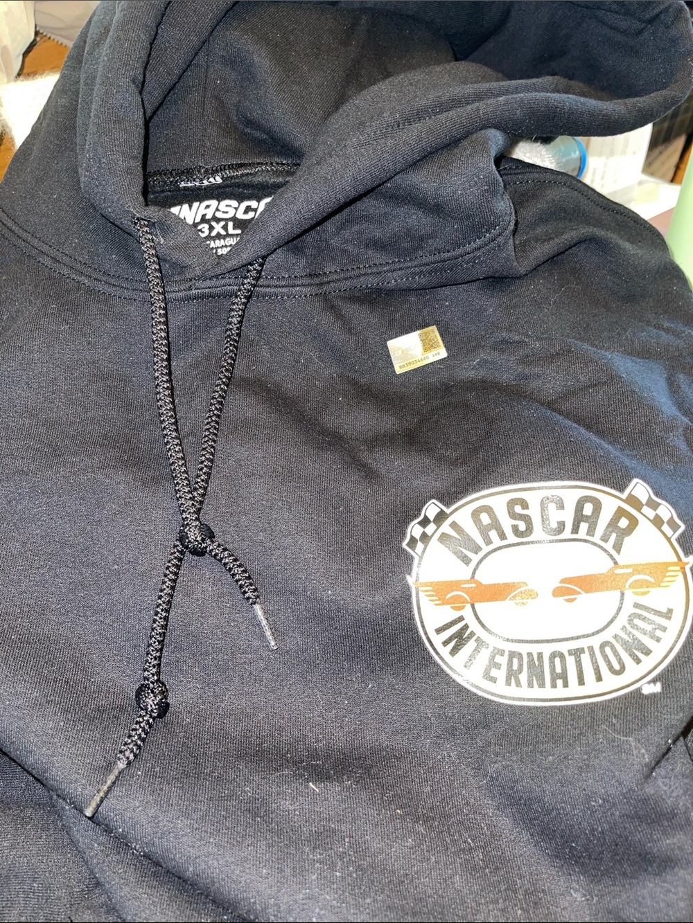 Nascar Black Pullover Hoodie with Small Logo on front and Large Logo on back.